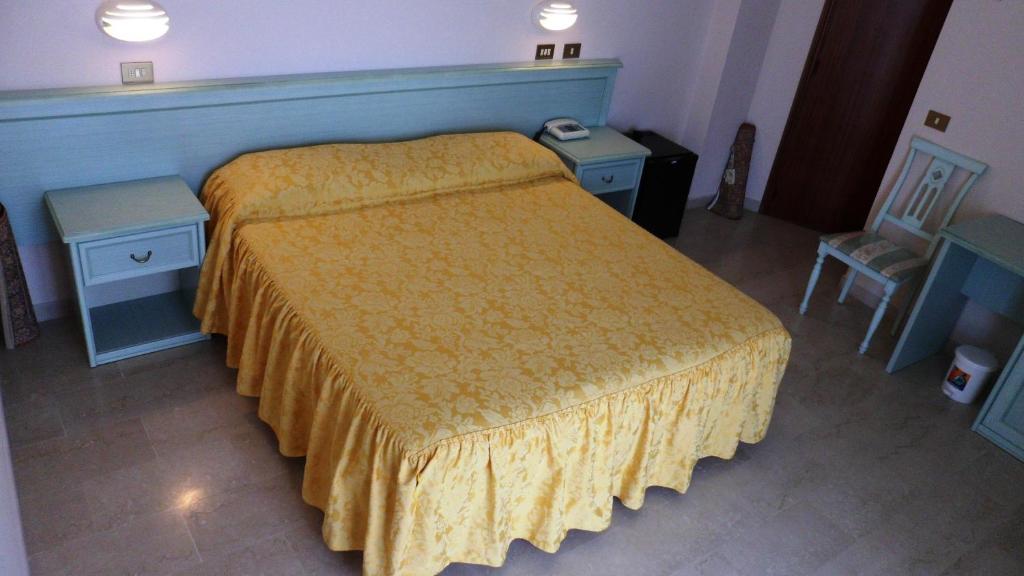 Postel nebo postele na pokoji v ubytování Hotel Reali