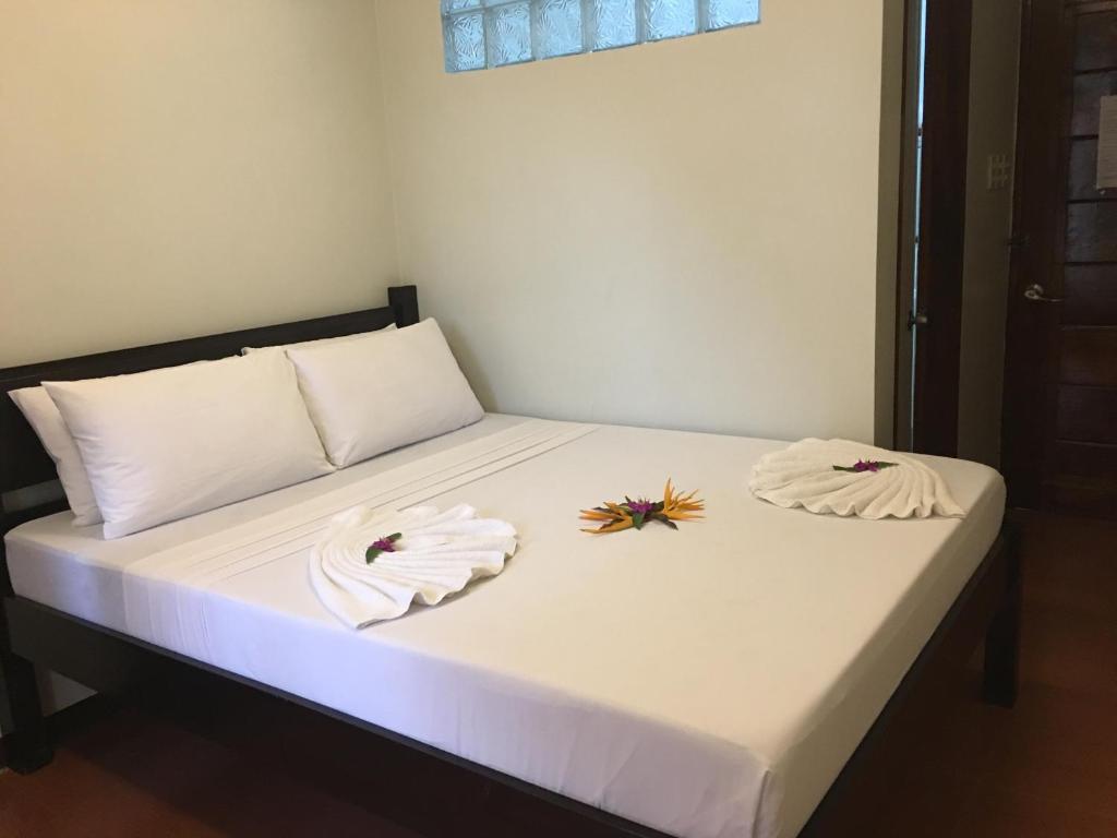 Postel nebo postele na pokoji v ubytování Seaslugs Travellers Inn