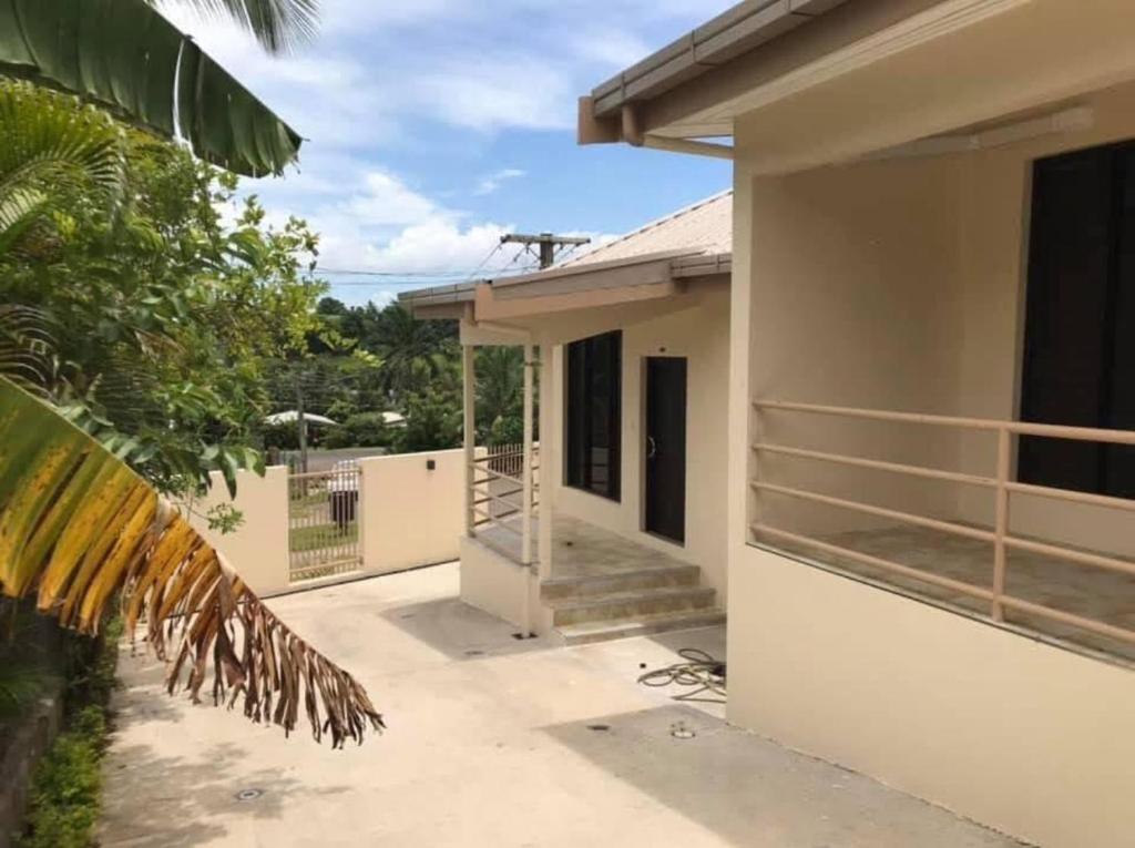 a house under construction with the front door open at Waiyavi Apartments in Lautoka