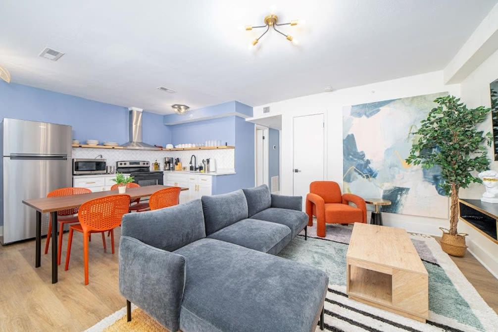 a living room with a couch and a table at Sojourn's Harborage 2 BR 1 BA in Norfolk