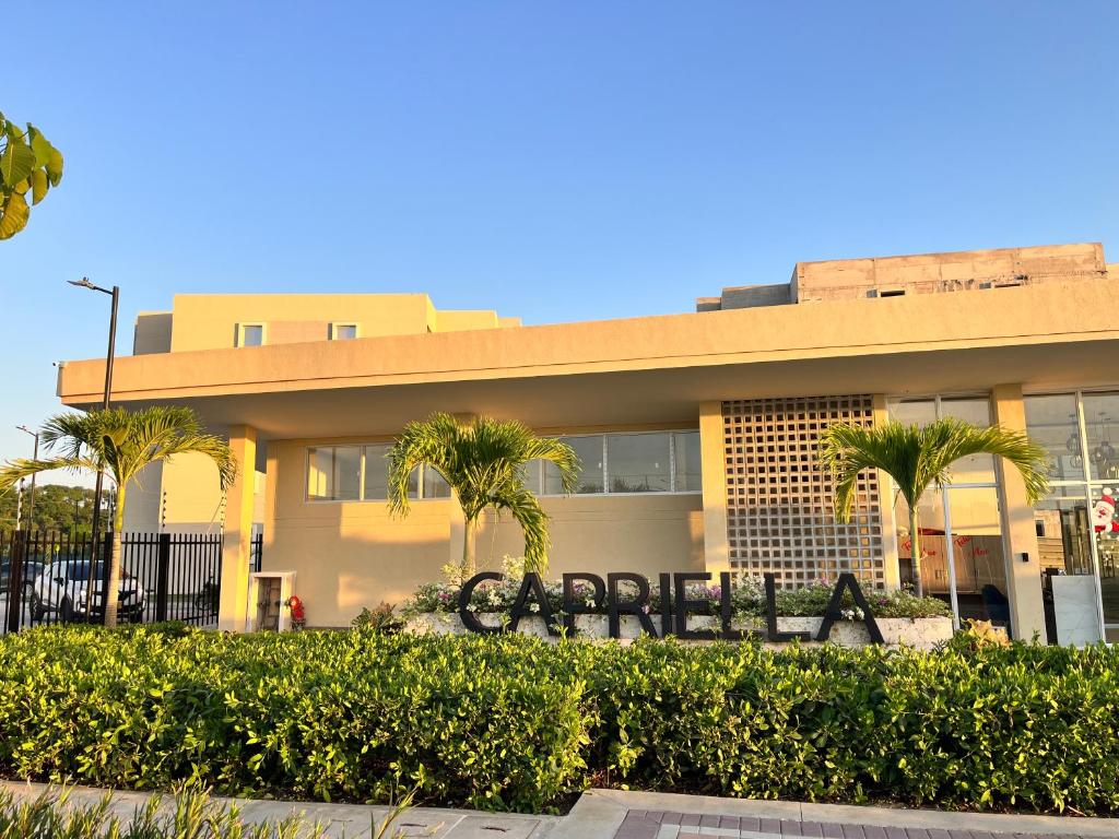 a building with a sign in front of it at Sueños de Serena del Mar in Cartagena de Indias