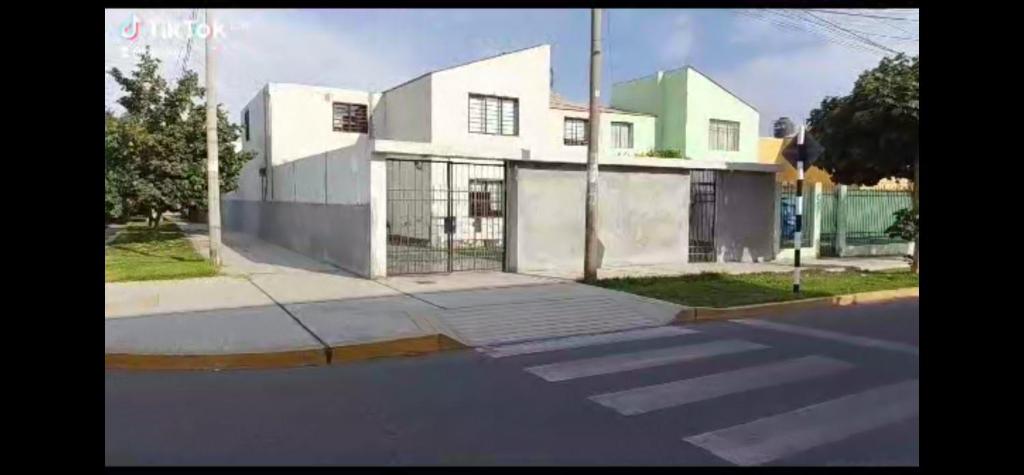 a house on the side of a street at Dodig in Chincha
