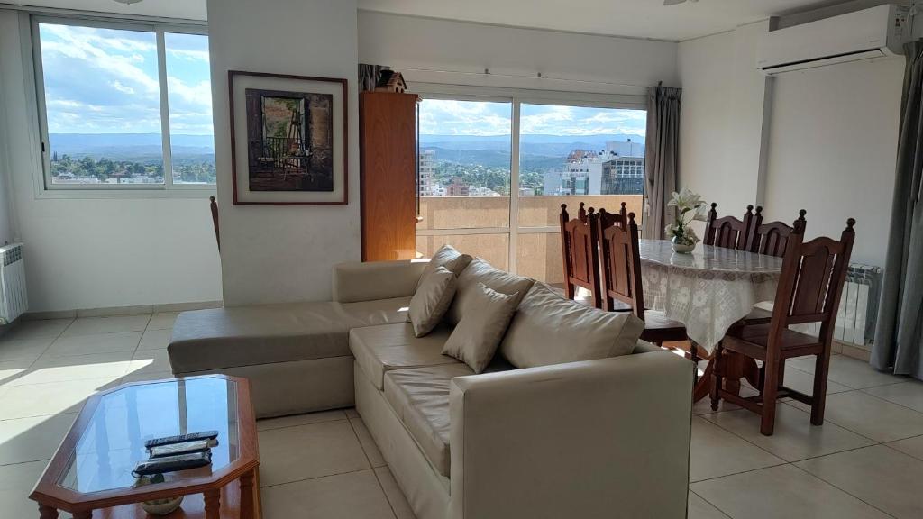 a living room with a couch and a table at Torre del Lago in Villa Carlos Paz