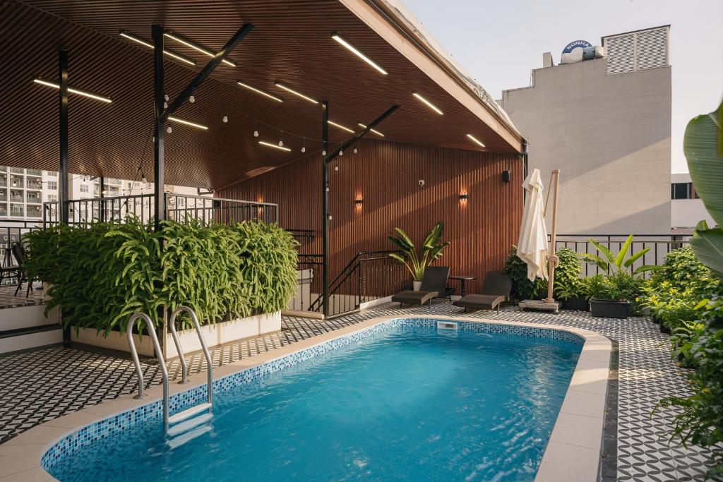 a swimming pool on the side of a building at Quatorze Hotel in Hanoi