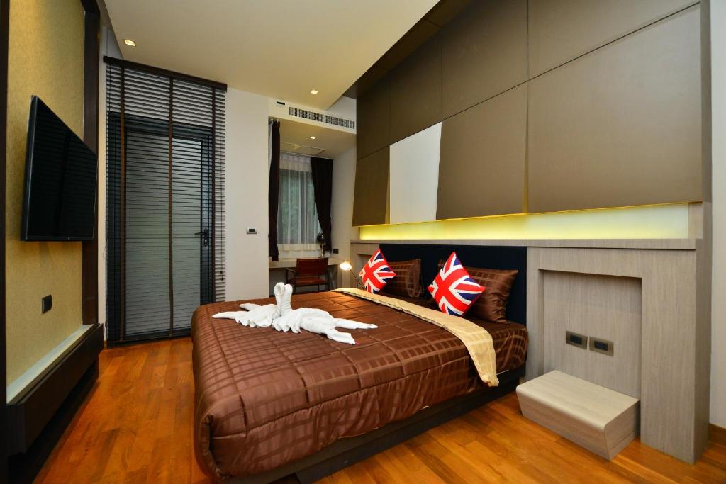 Postel nebo postele na pokoji v ubytování Bukit Pool Villas - SHA Extra Plus