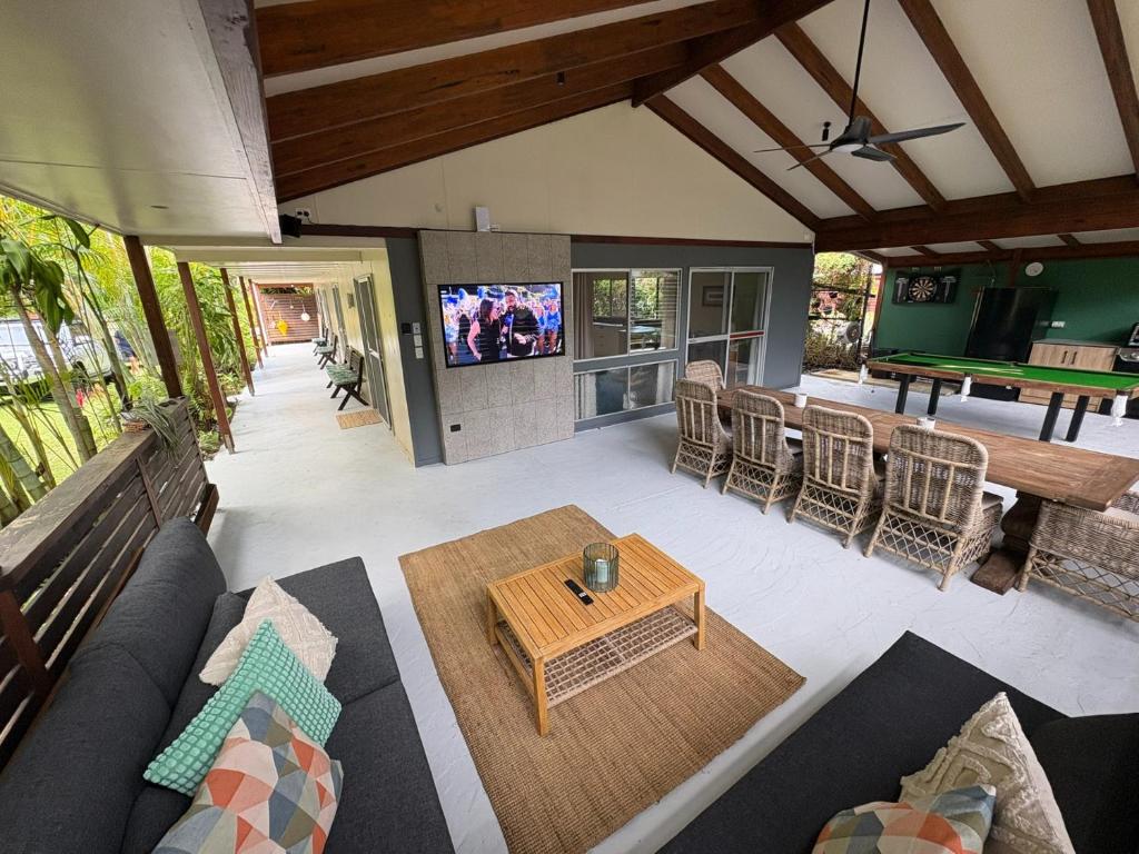 an open living room with a couch and a table at Cowan Lodge in Cowan Cowan