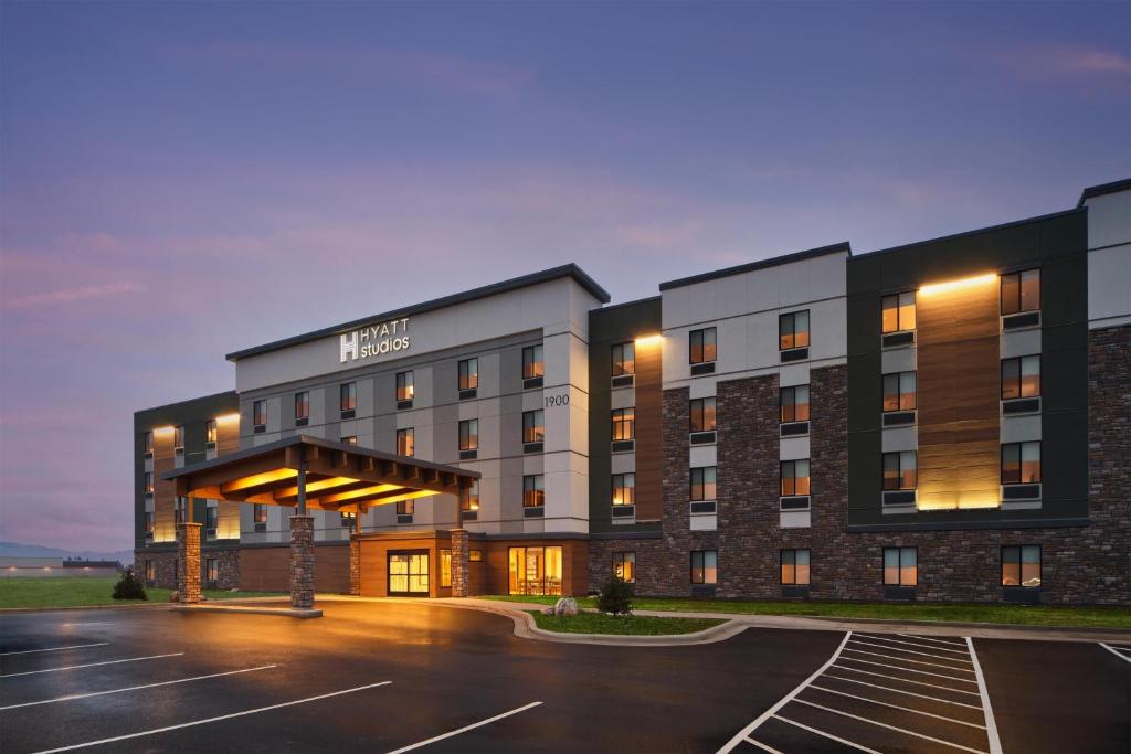 a rendering of a hotel with a parking lot at Hyatt Studios Kalispell in Kalispell