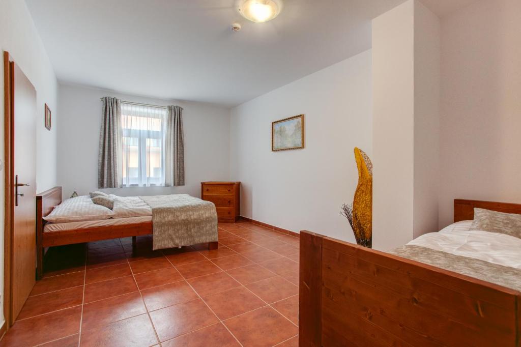 Postel nebo postele na pokoji v ubytování Apartmány U Anděla