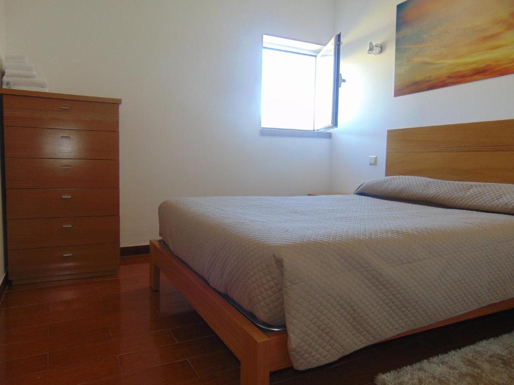 Postel nebo postele na pokoji v ubytování Funileiro, apartamentos e quartos