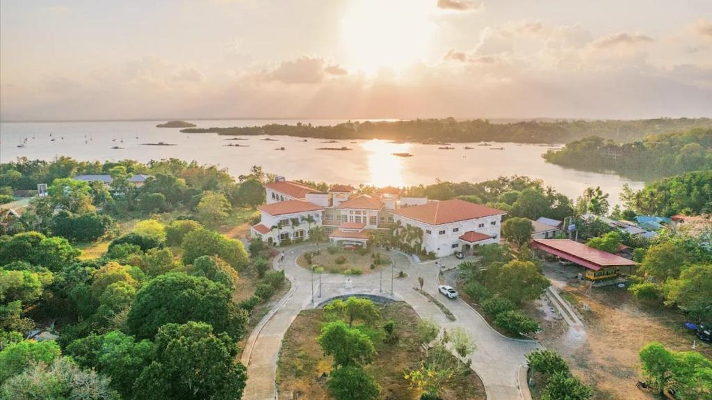 an aerial view of a house with a lake at Palawan Coliving - Palawan Coworking in Puerto Princesa City
