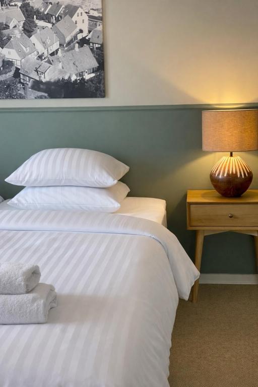 En eller flere senge i et værelse på Klippen Hotel - Grevens Dal