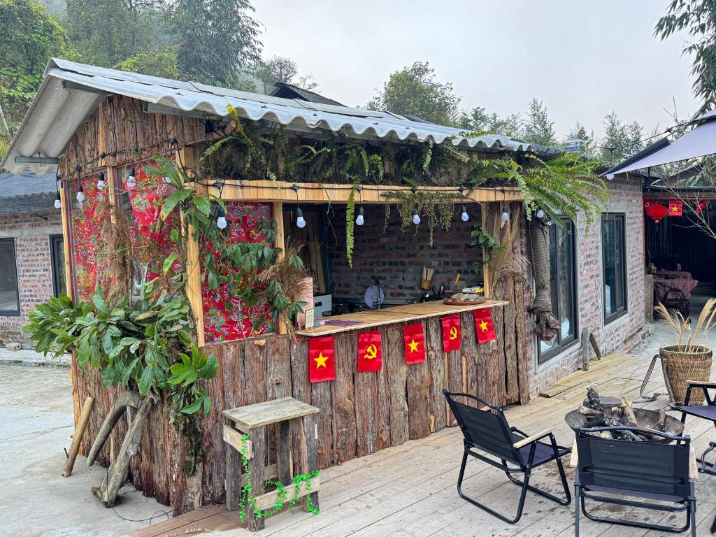 an outdoor kitchen with red lights on a building at Bản Sù in Sapa