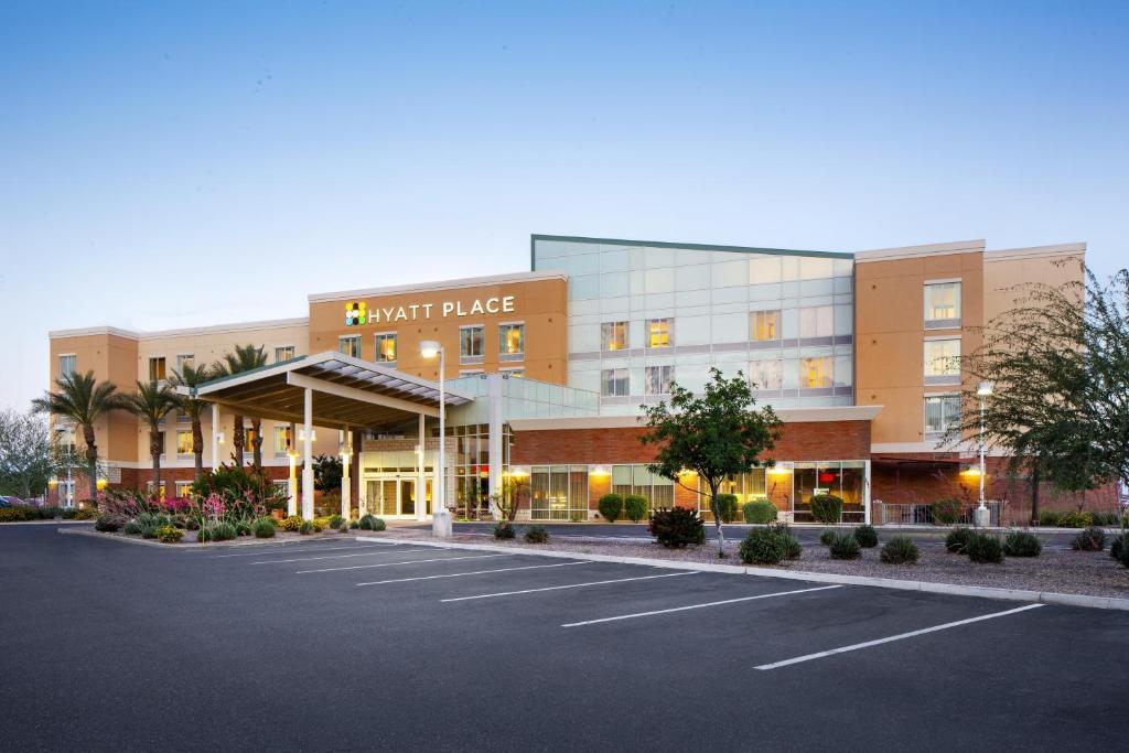 a parking lot in front of a hotel palace at Hyatt Place Phoenix/ Mesa in Mesa