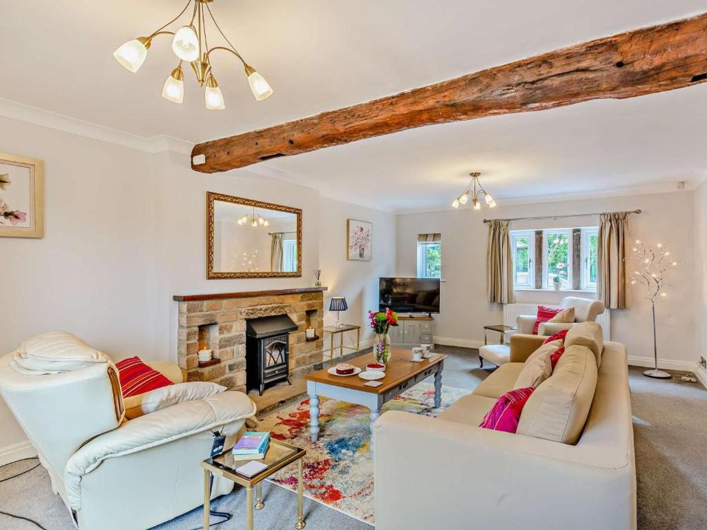 a living room with white furniture and a fireplace at 3 Bed in Harrogate oc-93305 in Summer Bridge