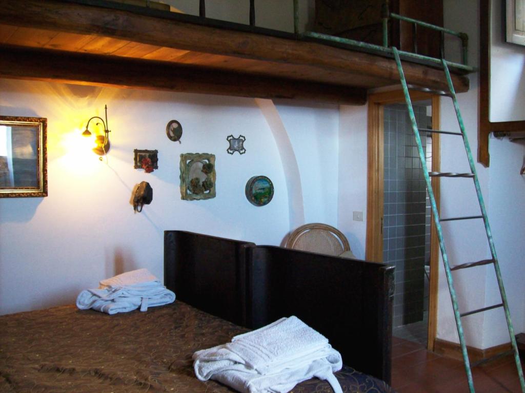 Postel nebo postele na pokoji v ubytování La Locanda del Barbablù