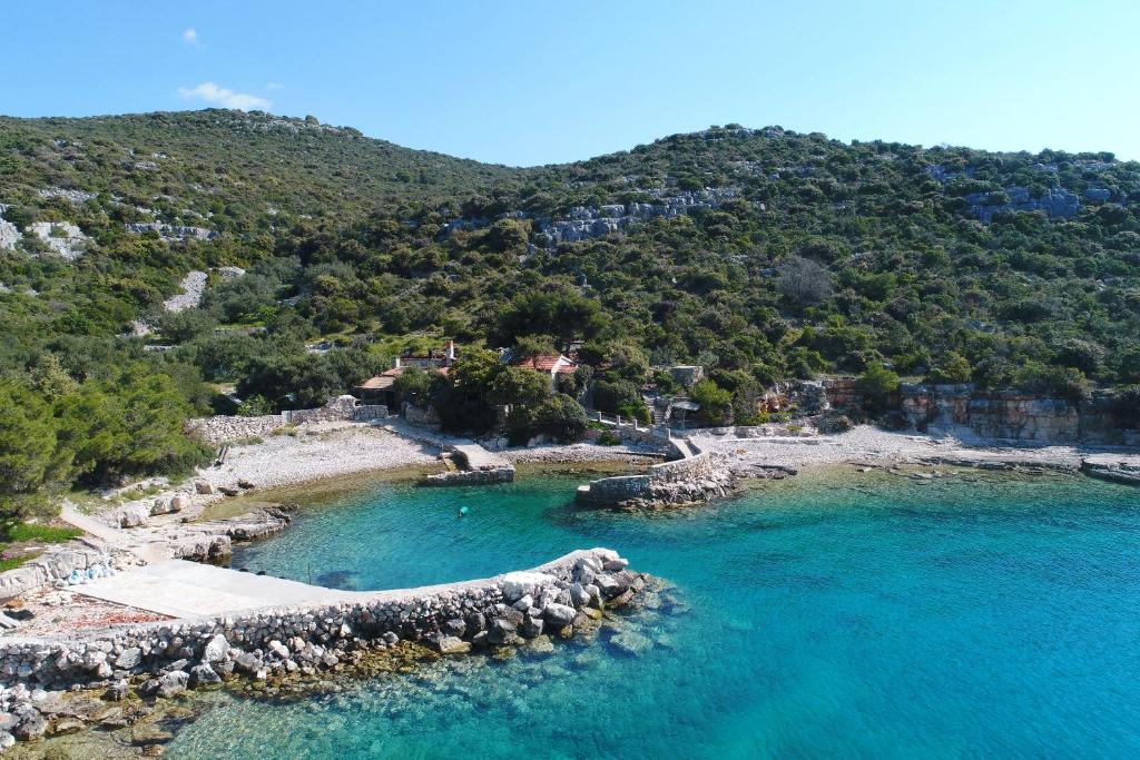 an aerial view of a beach with blue water at House Sarah in Tkon