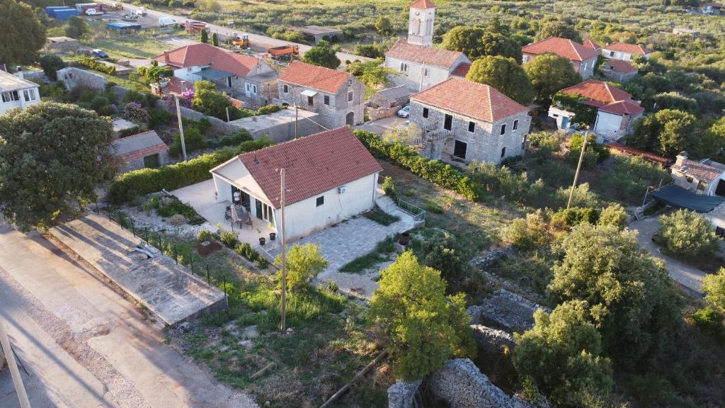 an aerial view of a small village with a church at House Pavicic in Poljica