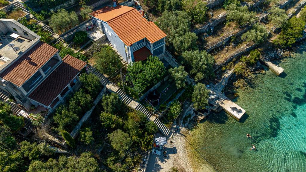 an aerial view of a house next to the water at Villa Naty with Whirlpool by Villas Guide in Vela Luka