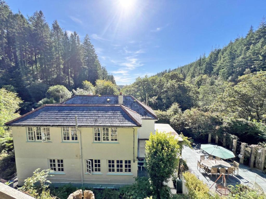 a house with solar panels on the roof at The lodge in Bodmin