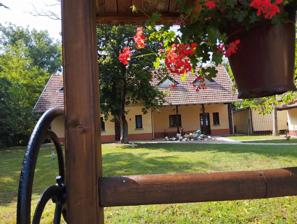 a view of a house from a window with a yard at Kiscsengőd Vendégház in Csengőd