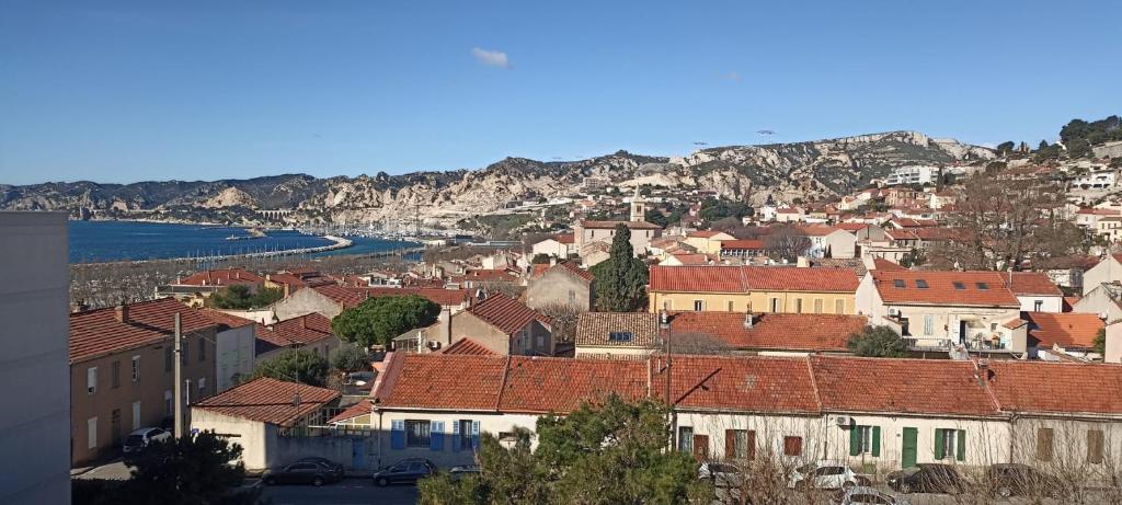 a view of a town with houses and the water at Marseille Estaque in Marseille
