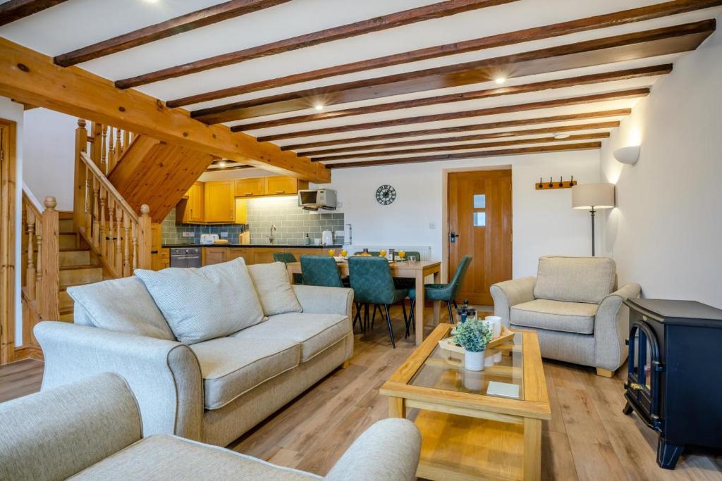 a living room with a couch and chairs and a table at 2 Bed in Knayton oc-b35995 in Knapton