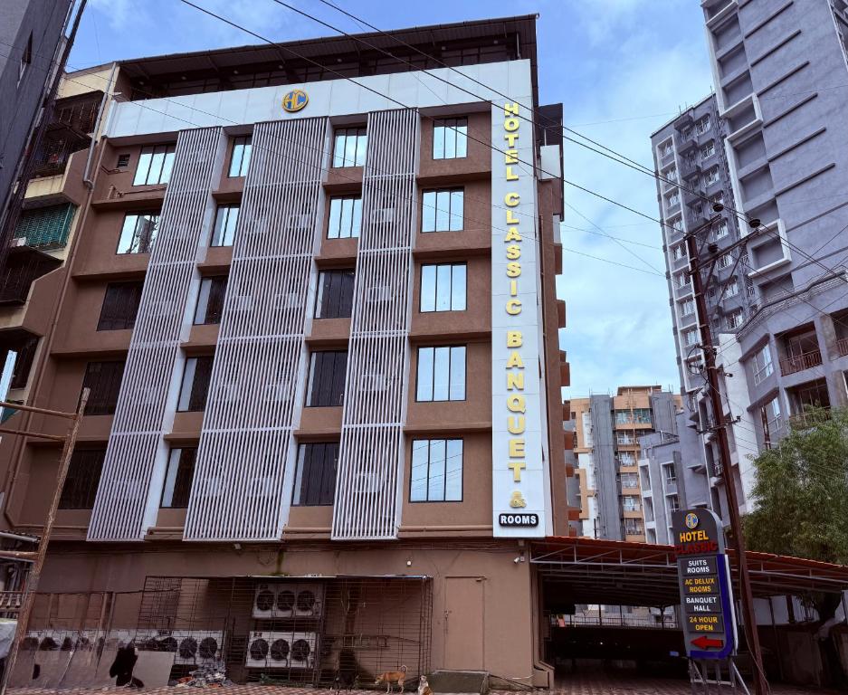 a building with a sign for a hotel at Hotel Classic Badlapur - Premium Couple Friendly Hotels in Badlapur in Badlapur