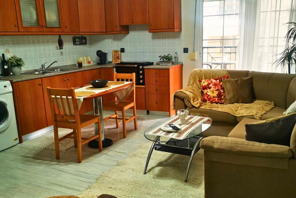 a living room with a couch and a table at Sotiris Urban Stay in Xanthi