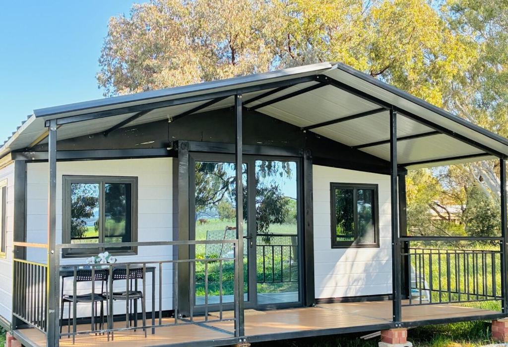 a screened in porch on a tiny house at Beautiful Pradise 1 in Penfield