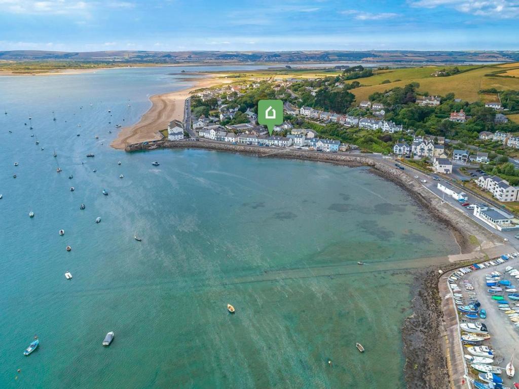 an aerial view of a beach with boats in the water at 4 Bed in Bideford oc-incot in Instow