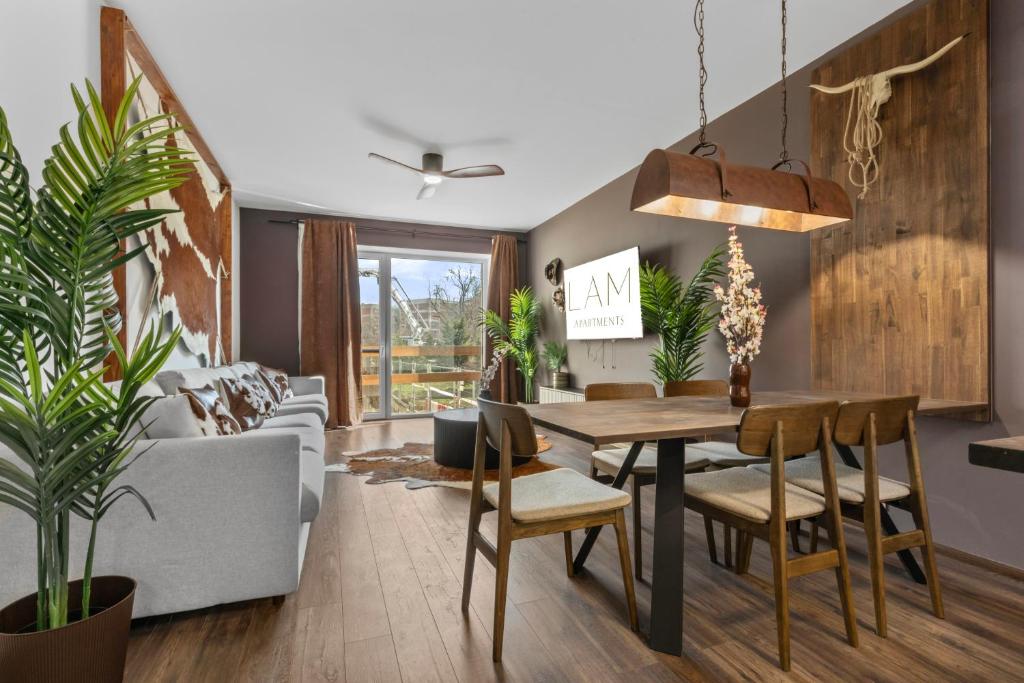 a living room with a table and a couch at LAM Western AC in Bratislava
