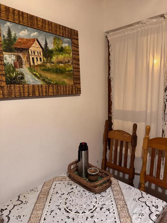 a table with a coffee pot on top of it at Raíces Vivas Selva Misionera in Oberá
