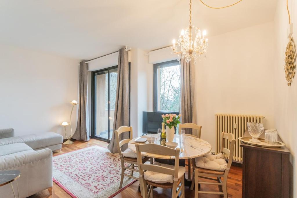 a living room with a table and a couch at Lara home in Campione dʼItalia