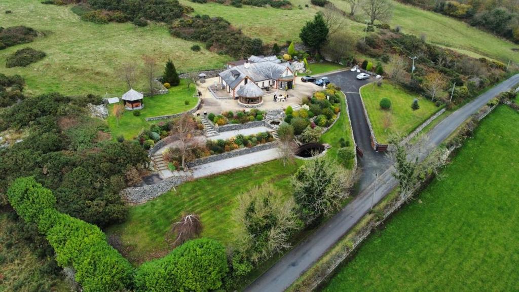 an aerial view of a mansion with a road at The Walnut Retreat Castlewellan in Ballyward