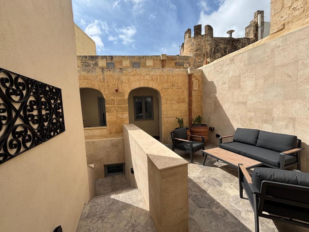 a balcony of a building with a castle in the background at 3 Doni in Rabat