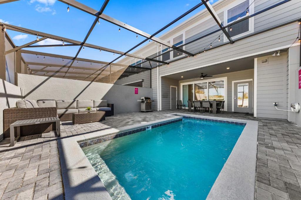 a swimming pool in the backyard of a house at 16148 Palm Frond Ave in Orlando
