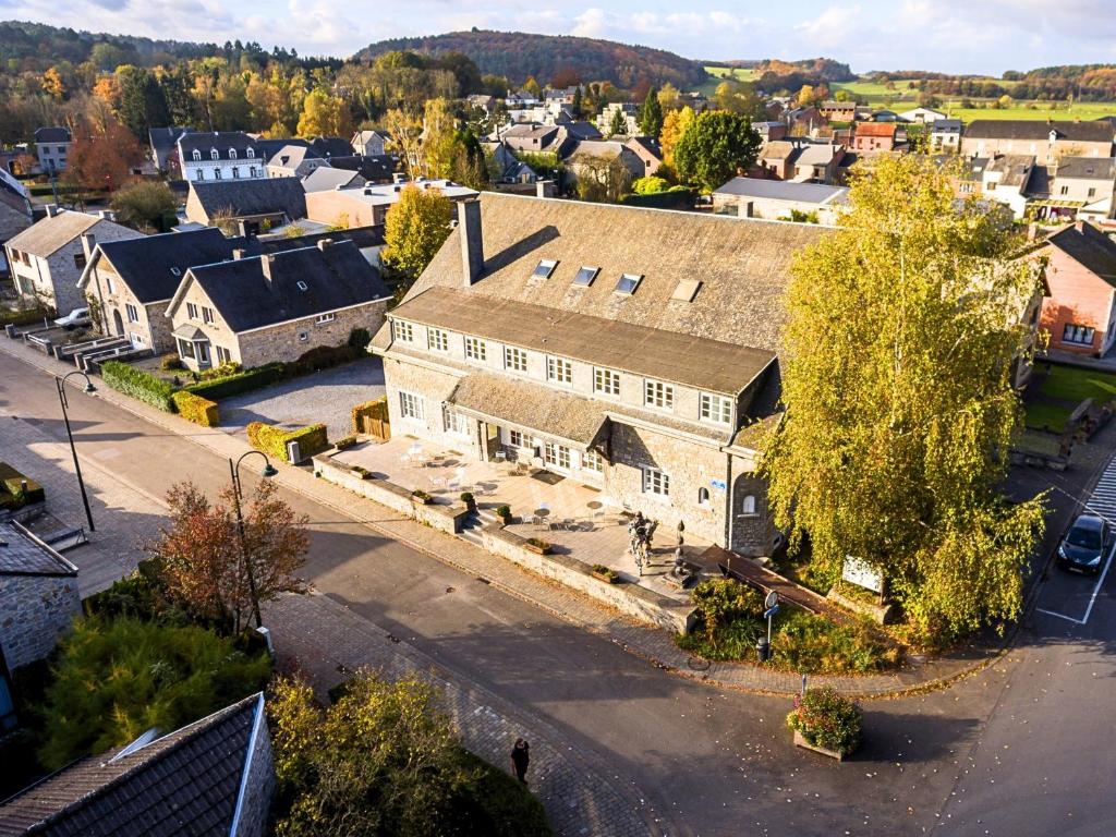 an aerial view of a large building in a town at Gîte Kaleo Han-Sur-Lesse in Han-sur-Lesse
