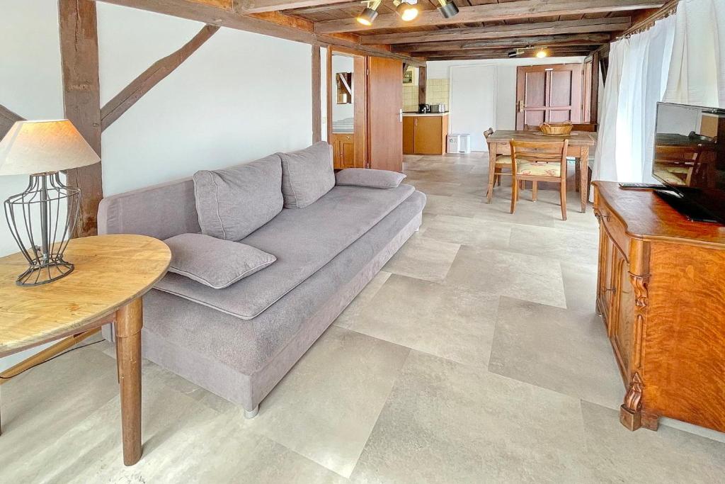 a living room with a couch and a table at Altstadtflair - Rüster in Lübbenau