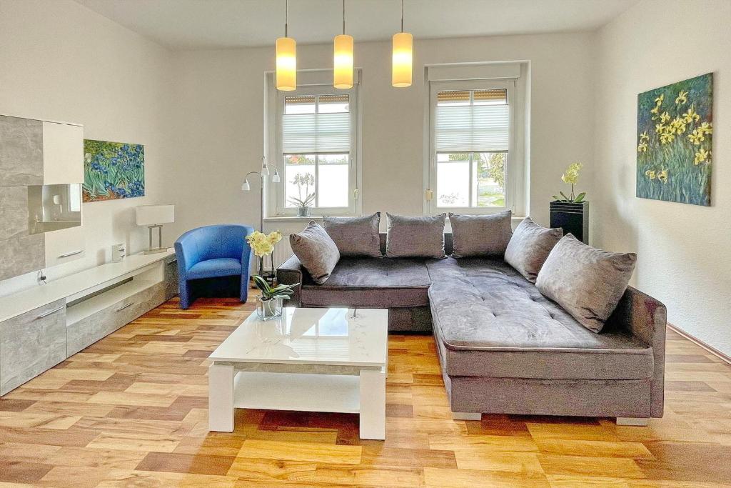 a living room with a couch and a table at Malve in Lübbenau