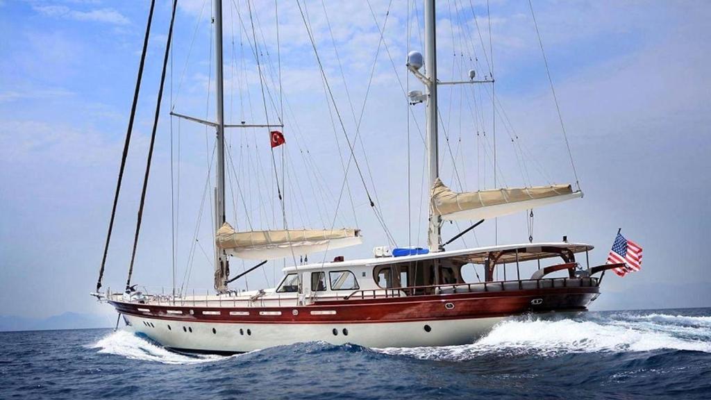 a boat in the water with an american flag at gold in Fethiye