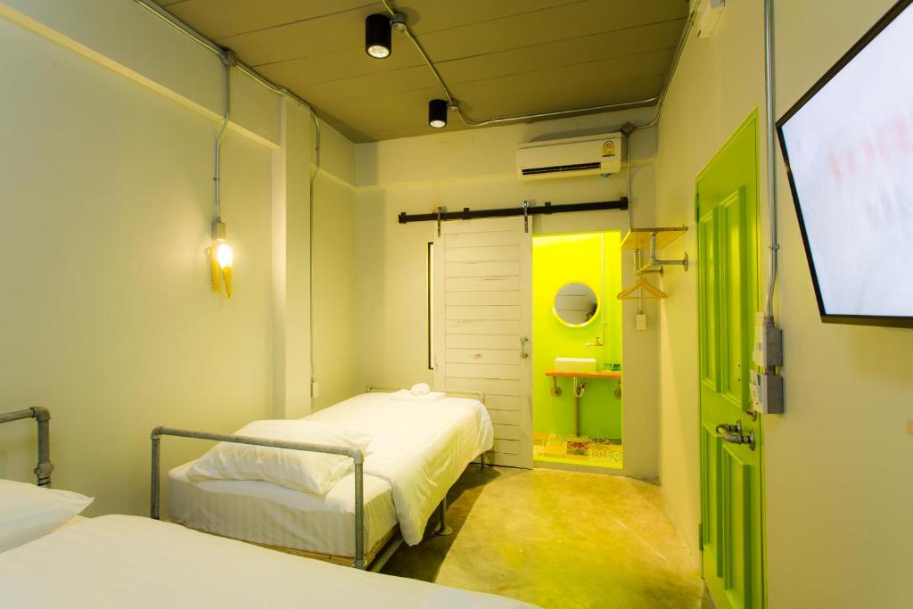 Postel nebo postele na pokoji v ubytování Bloo Hostel