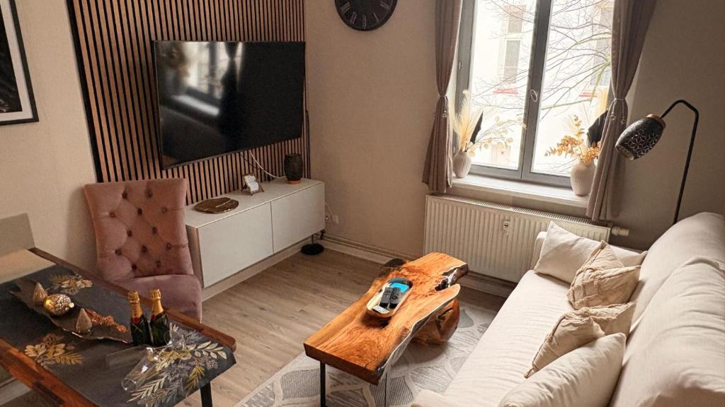 a living room with a couch and a table at Apartment Baltica in Rostock