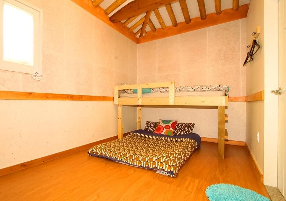 Postel nebo postele na pokoji v ubytování Dorandoran Guesthouse