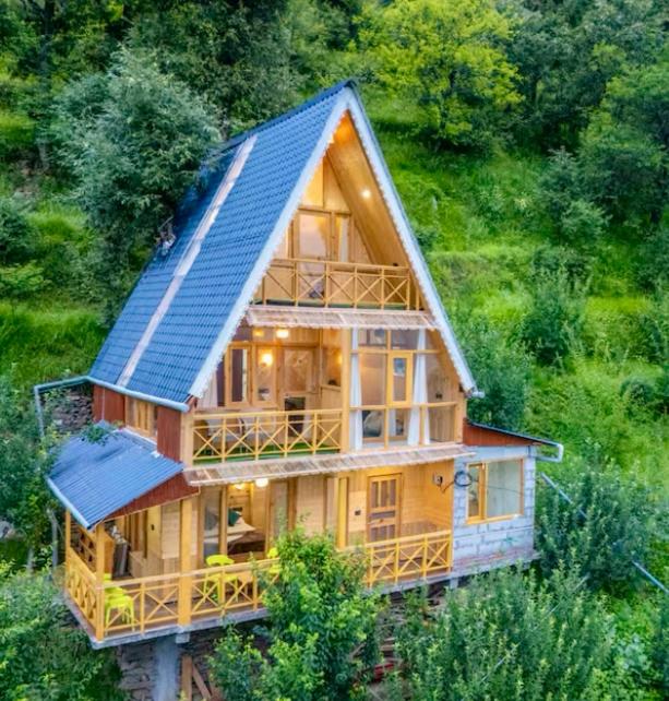 an overhead view of a house with a solar roof at The nature view A shaped tree cottage in Banjār