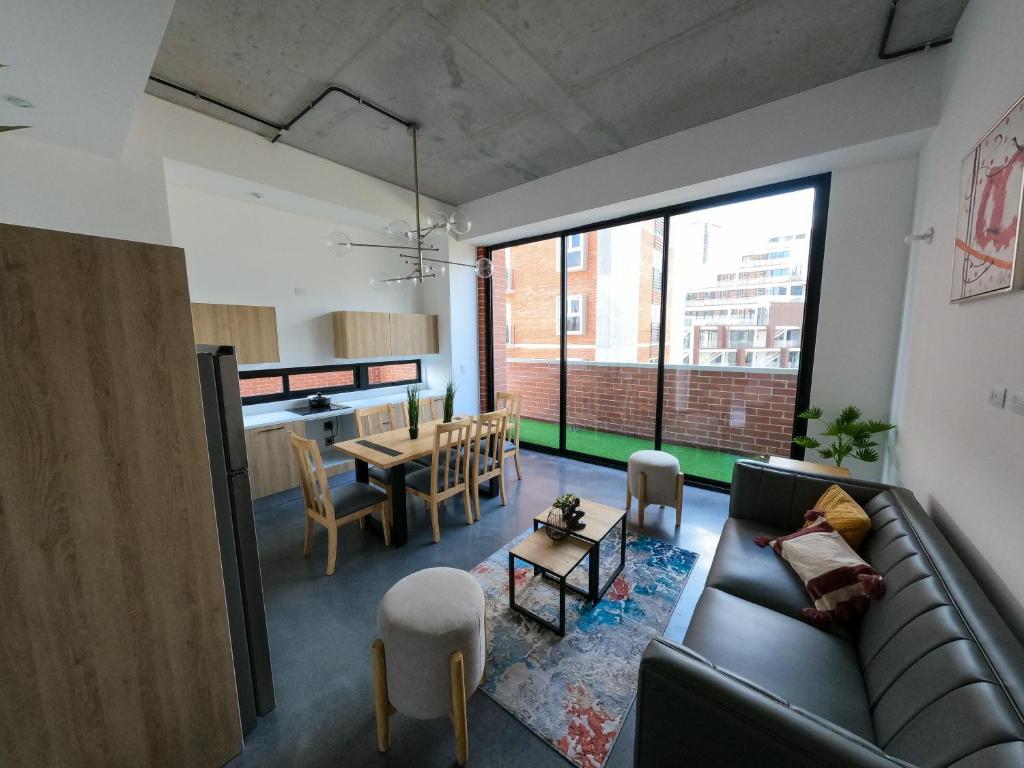 a living room with a couch and a table at Atom Cuatro 303 in Guatemala