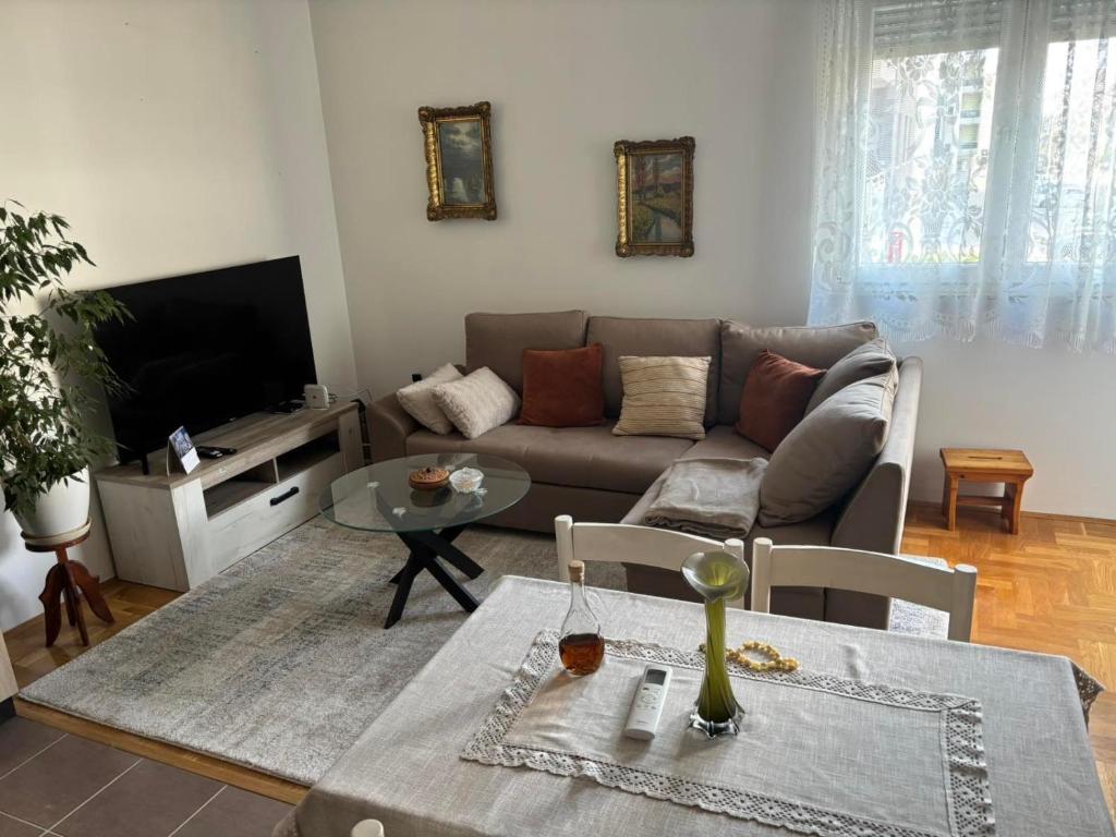 a living room with a couch and a table at Lana in Trebinje