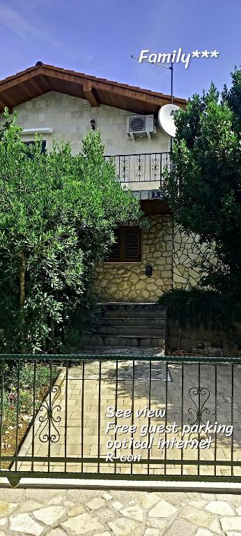a house with a fence in front of it at Family*** in Selce
