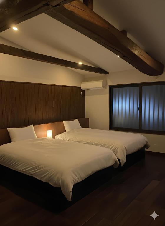 two beds in a room with at BLANKS - Vacation STAY 37519v in Taisha