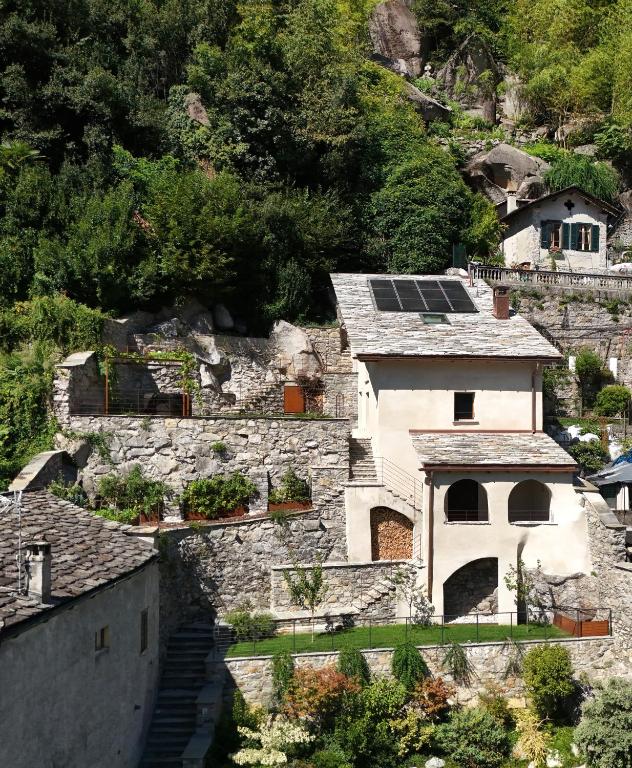 a house with solar panels on its roof at Al Crotto in Chiavenna