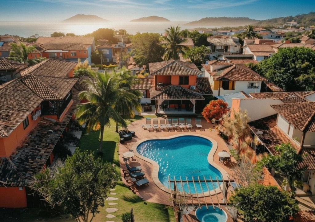an aerial view of a resort with a swimming pool at Pousada Sabledor in Búzios